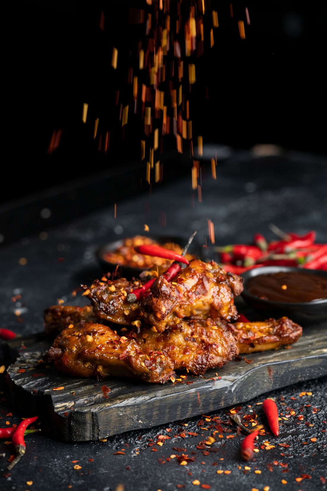 Hot wings dusted with chili flakes